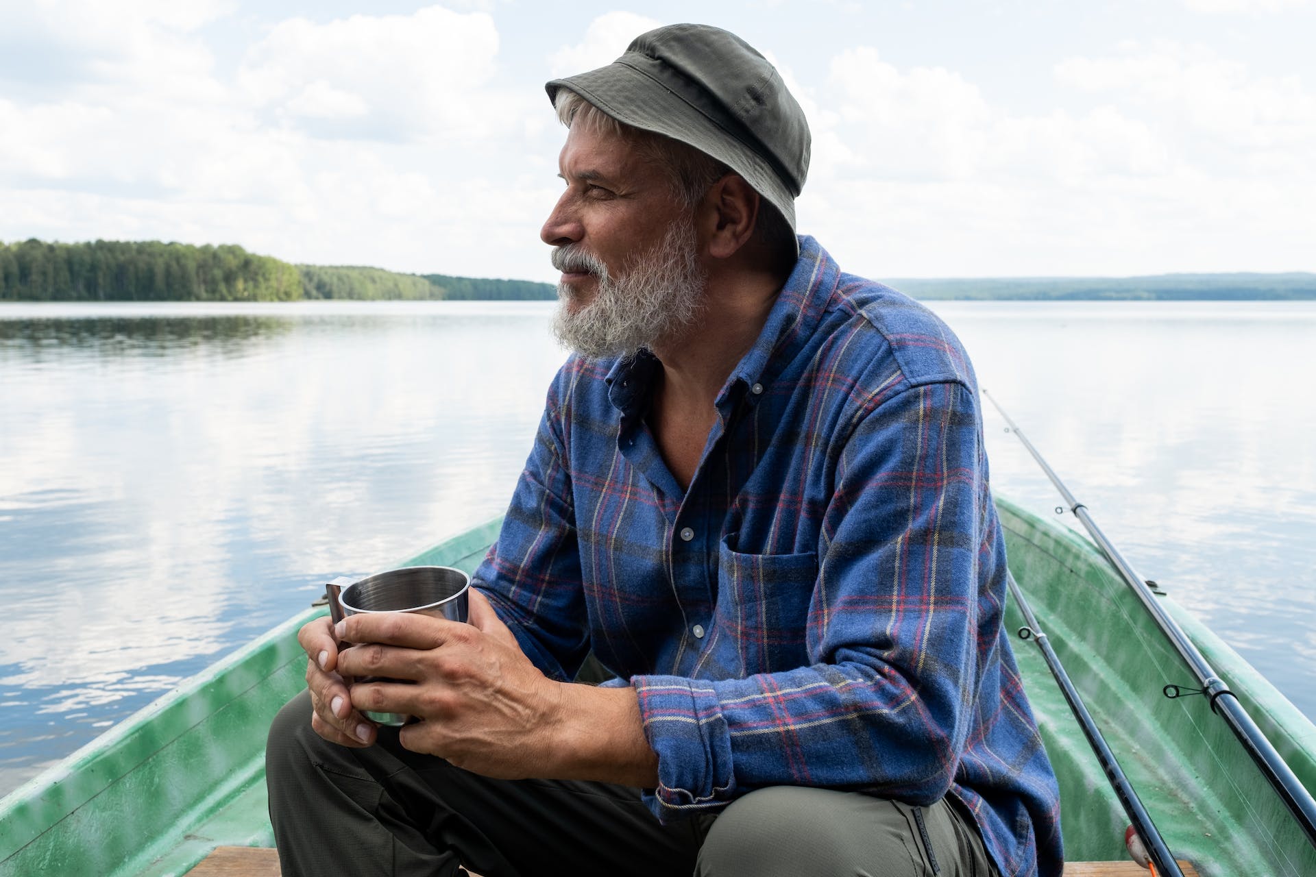 senior sitting on boat with coffee